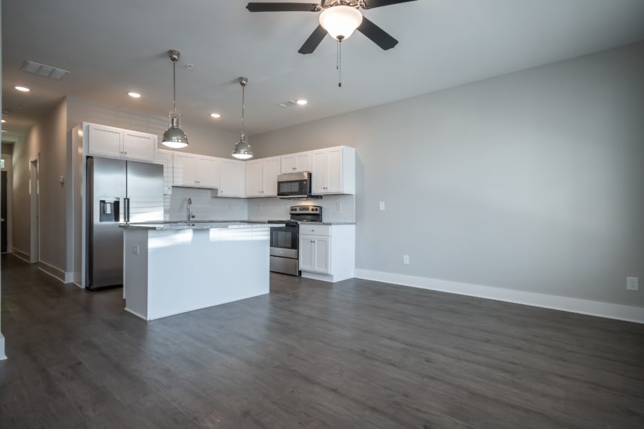 Modern kitchen in Puritan Mill townhome equipped with stainless steel appliances and granite countertops in Athens, GA.