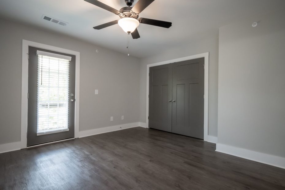 Cozy bedroom in Puritan Mill townhome with ample natural light and stylish decor in Athens, GA.