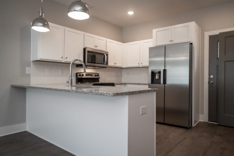 The Milledge 2-bedroom townhome floor plan at Puritan Mill in Athens, GA, featuring 2.5 baths and 1,046 sq. ft.