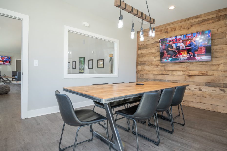 Modern clubhouse at Puritan Mill offering a coffee bar, game area, and private study rooms.
